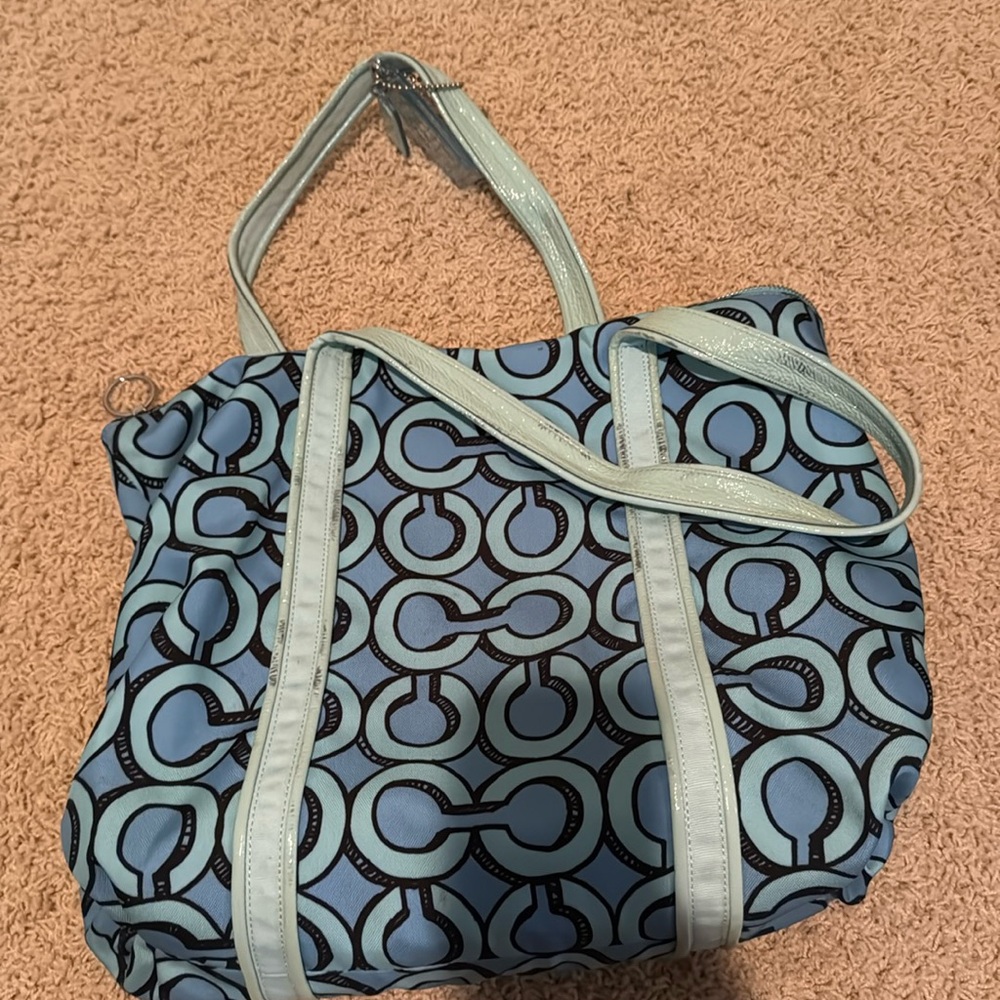 Coach tote bag. Color is blue and has silver detailing.